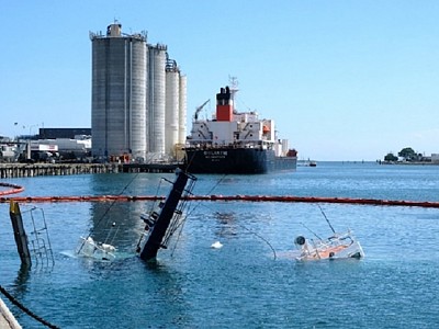 TasPorts starts court action against cement ship Goliath's owner over Devonport sunken tugboats